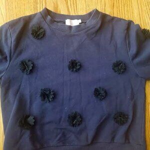 Chic Black Top with Floral Embellishments